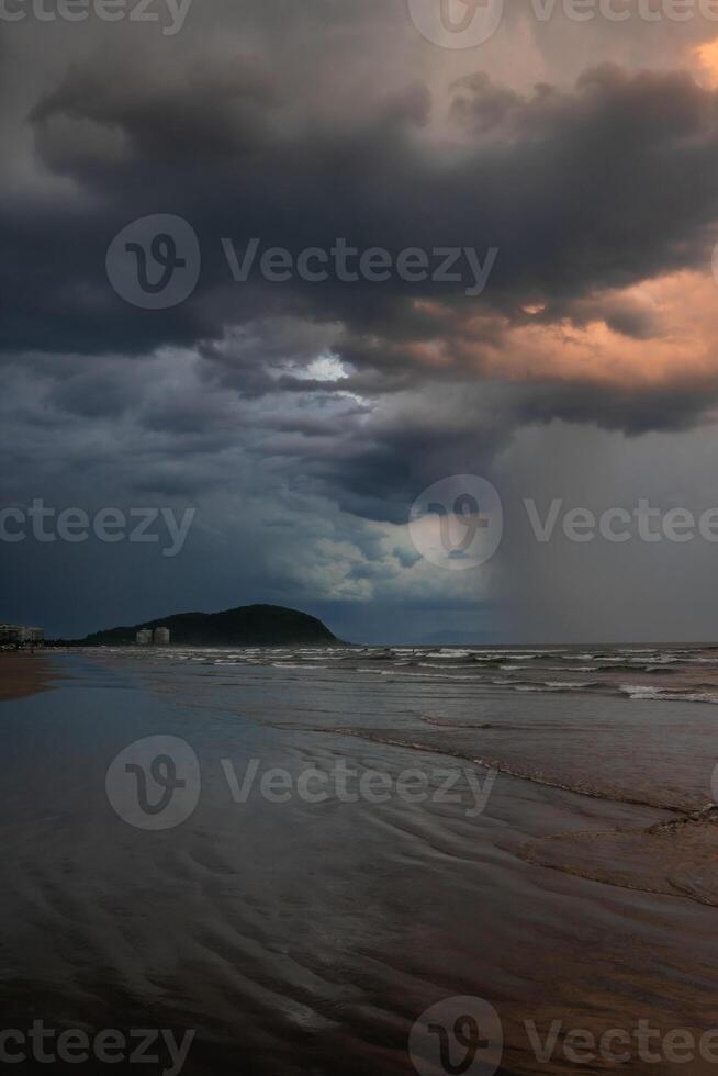 Dark clouds over the beach of Bertioga, Sao Paulo, Brazil. photo