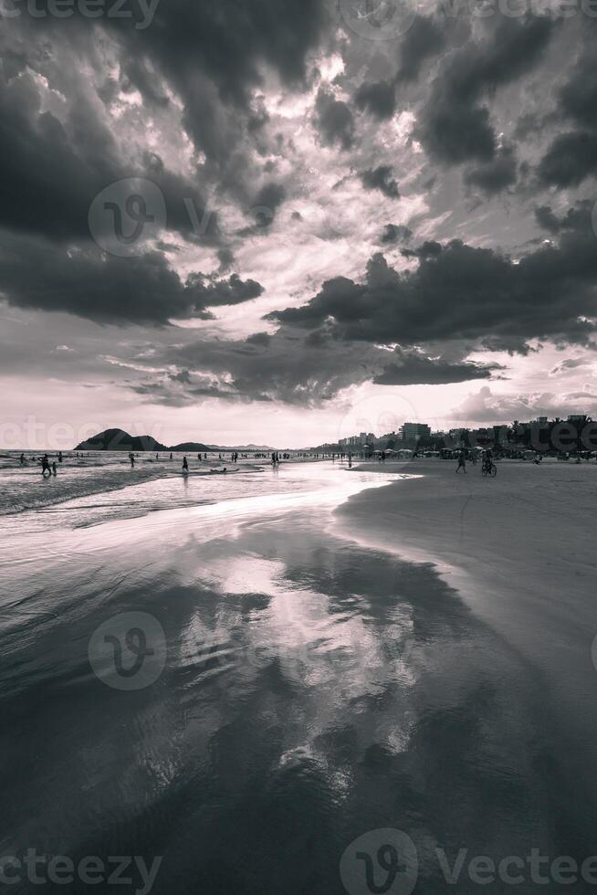 Beautiful sunset at the beach of Bertioga, Sao Paulo, Brazil. In black and white. photo