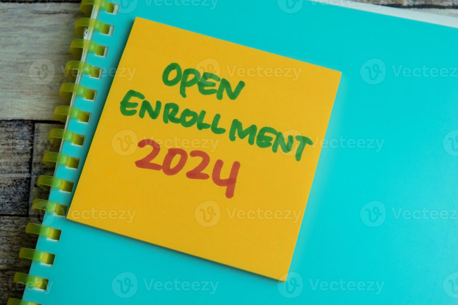 Concept of Open Enrollment 2024 write on sticky notes isolated on