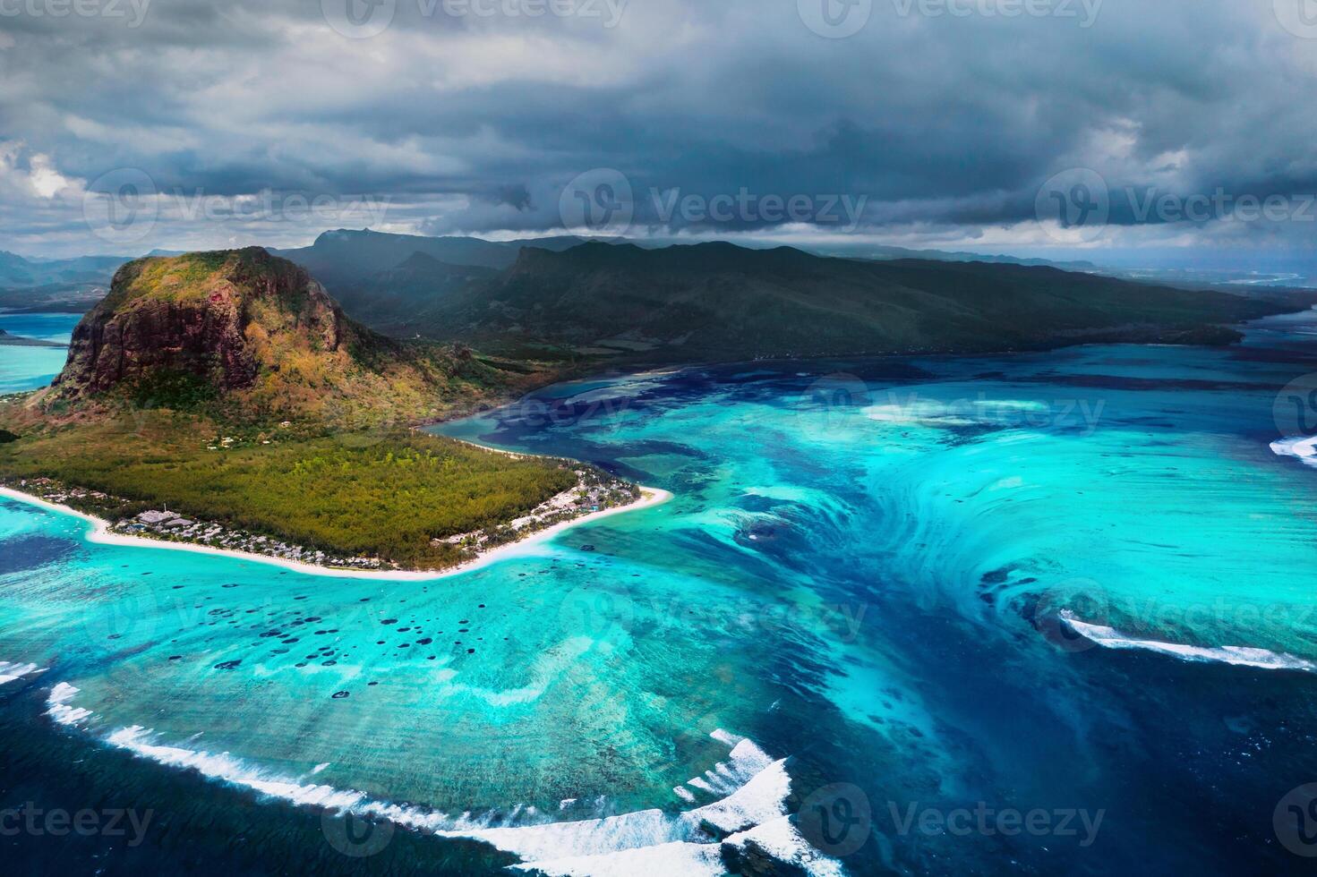 A bird's-eye view of Le Morne Brabant, a UNESCO world heritage site.Coral reef of the island of Mauritius.Storm cloud photo