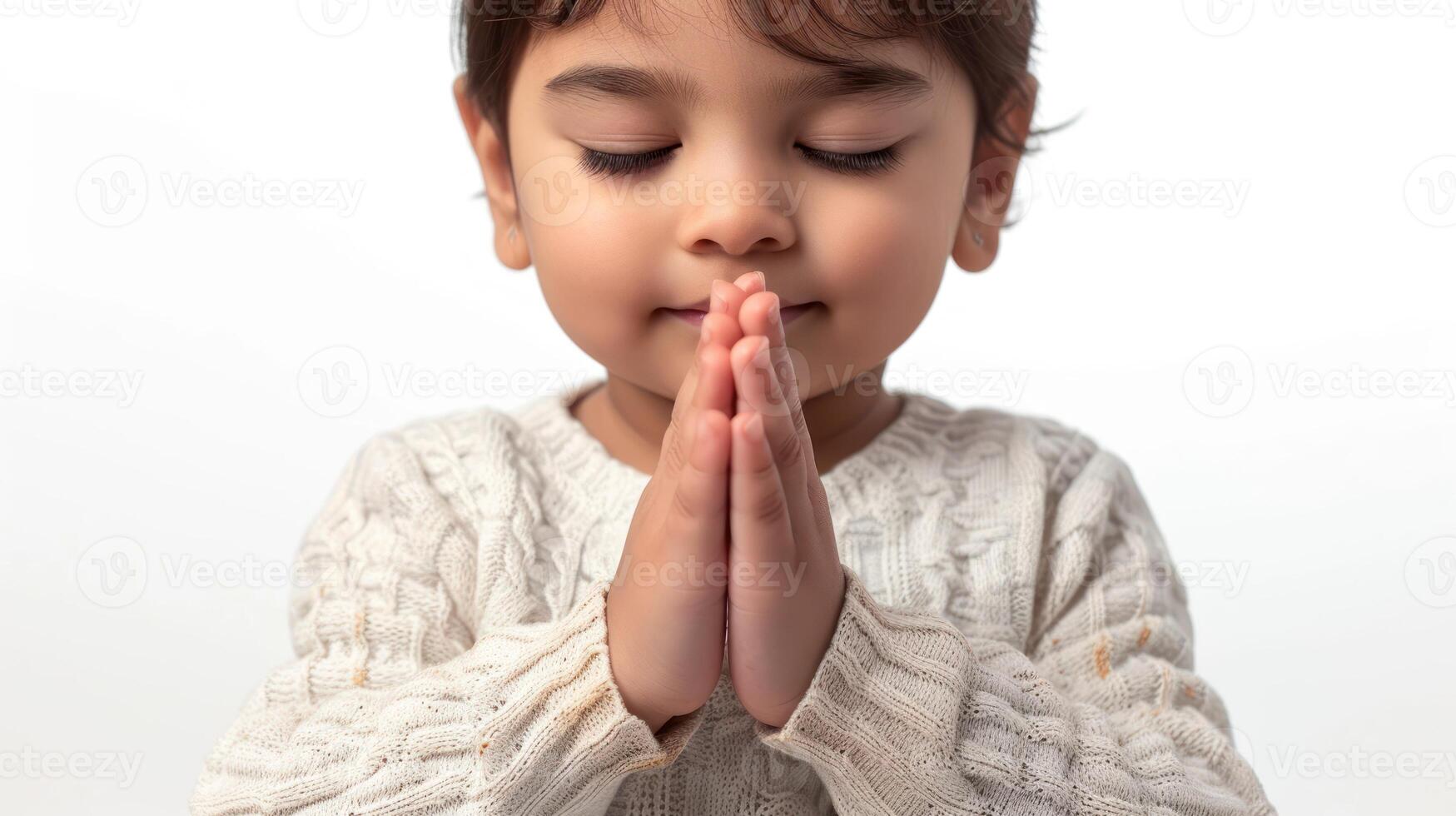 AI generated Cute little girl with hands clasped and praying isolated on white background.jpg photo