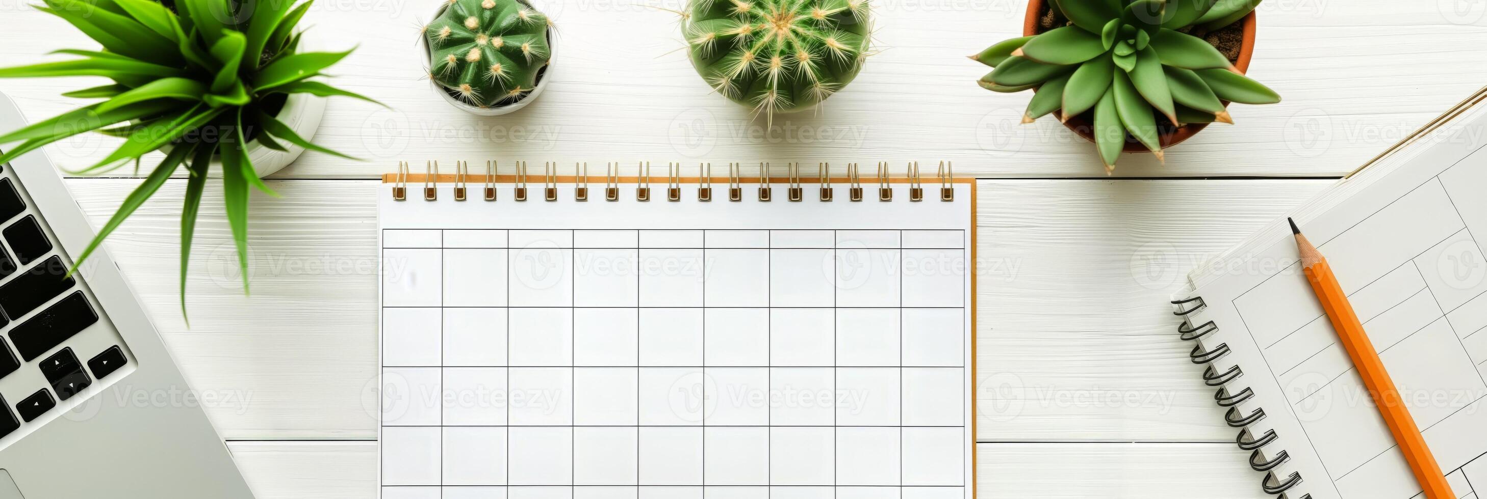 ai generado blanco mensual calendario en blanco de madera escritorio con computadora portátil, en conserva plantas, y lápiz, presentando Copiar espacio para planificación y organización conceptos foto