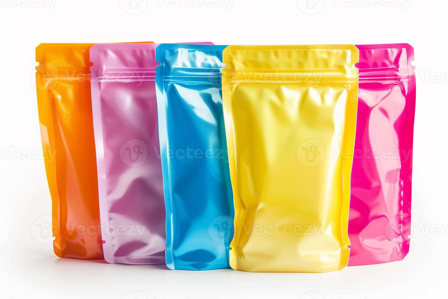 AI generated Colorful assorted blank foil pouch packaging standing on a white background, suitable for product mockup design photo