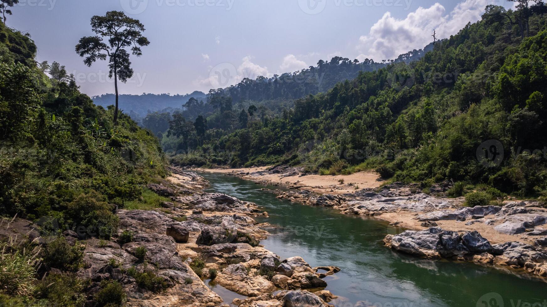 Serene Tropical River Landscape with Hills photo