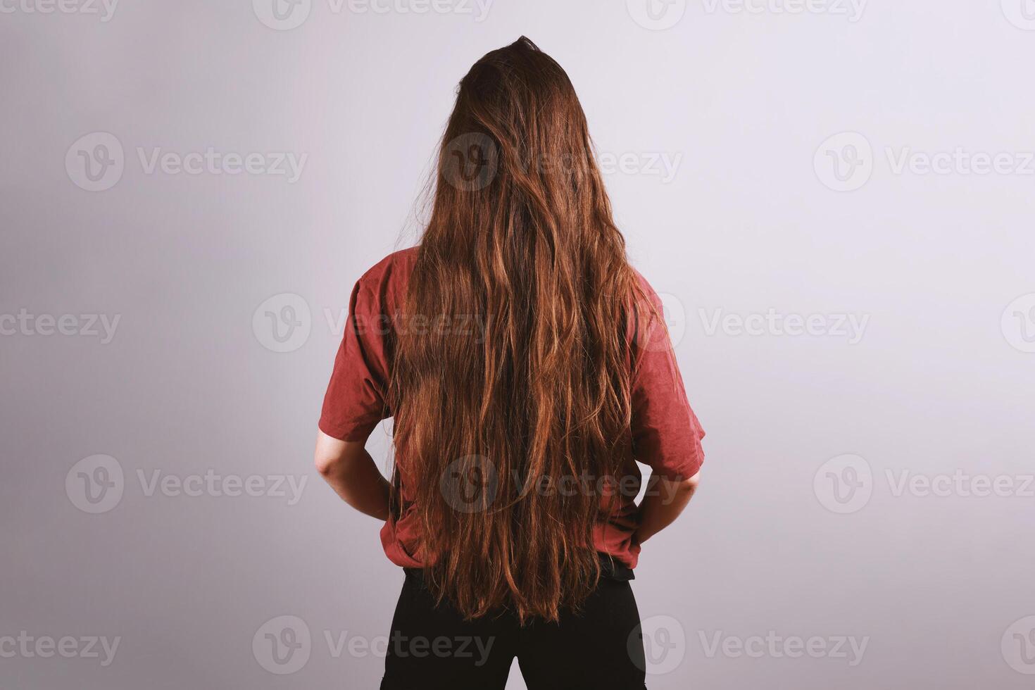 brunette woman with very long hair down to her butt photo