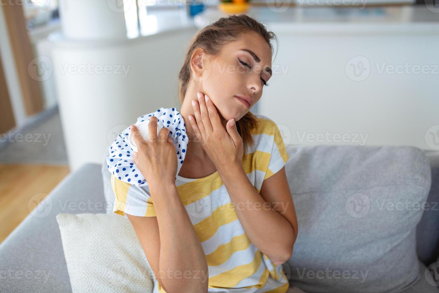 Pain in the shoulder. Upper arm pain, People with body-muscles problem, Healthcare And Medicine concept. Attractive woman sitting on the bed and holding painful shoulder with another hand. photo