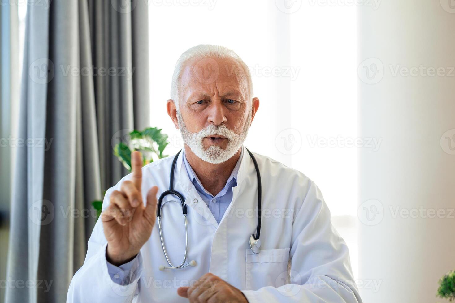 Doctor online. Senior medic talking to client on laptop computer