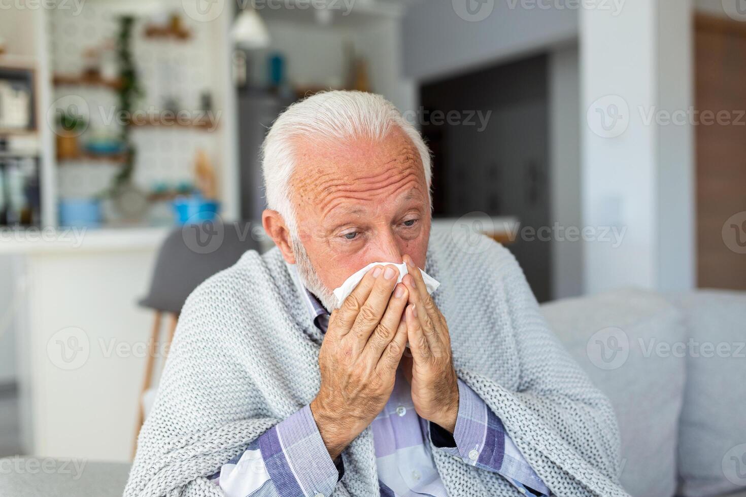 New coronavirus CoVid-19 outbreak situation with pandemic epidemic warning - adult caucasian senior old man with fever symptoms like illness cold seasonal influenza - people and virus concept photo