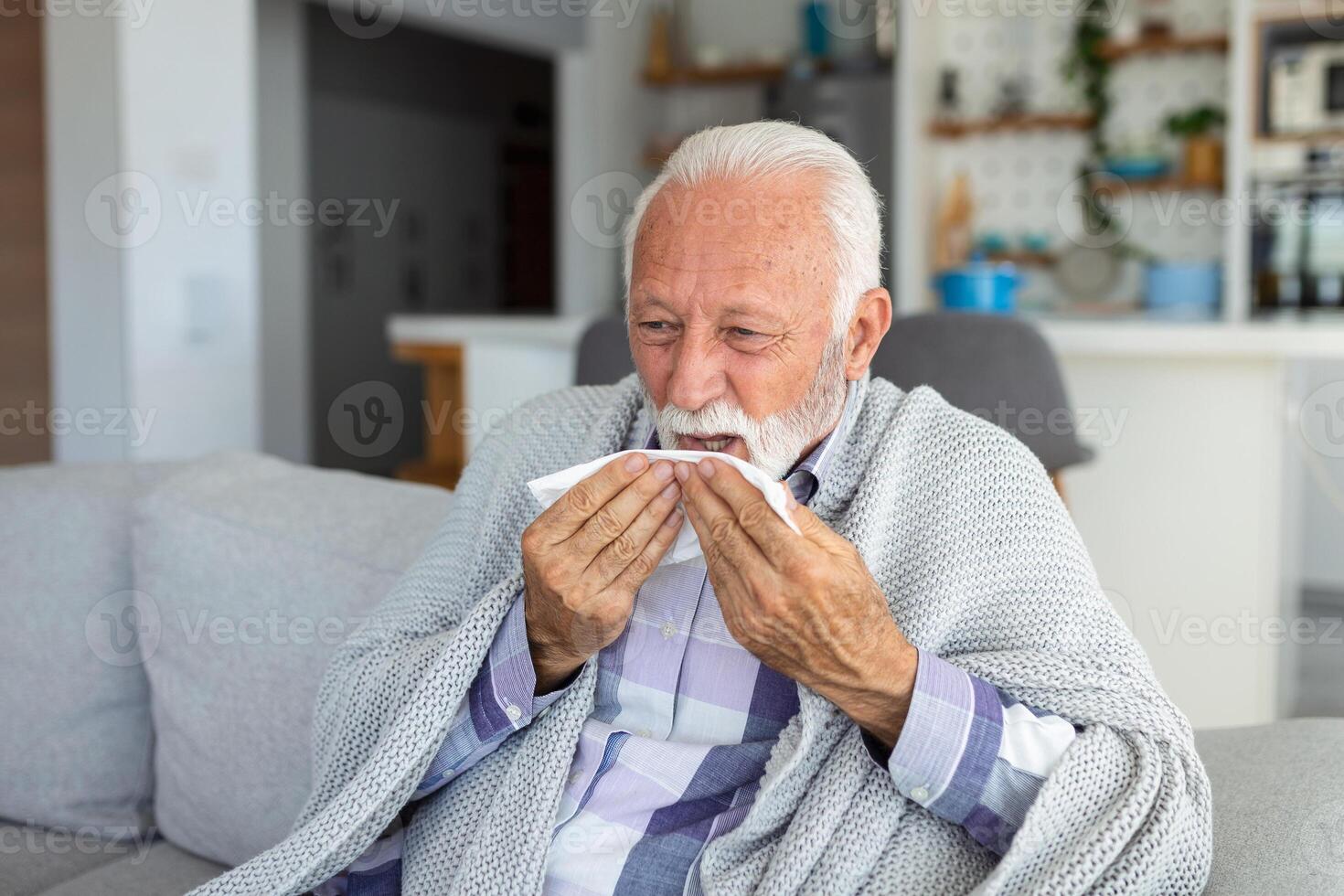 New coronavirus CoVid-19 outbreak situation with pandemic epidemic warning - adult caucasian senior old man with fever symptoms like illness cold seasonal influenza - people and virus concept photo