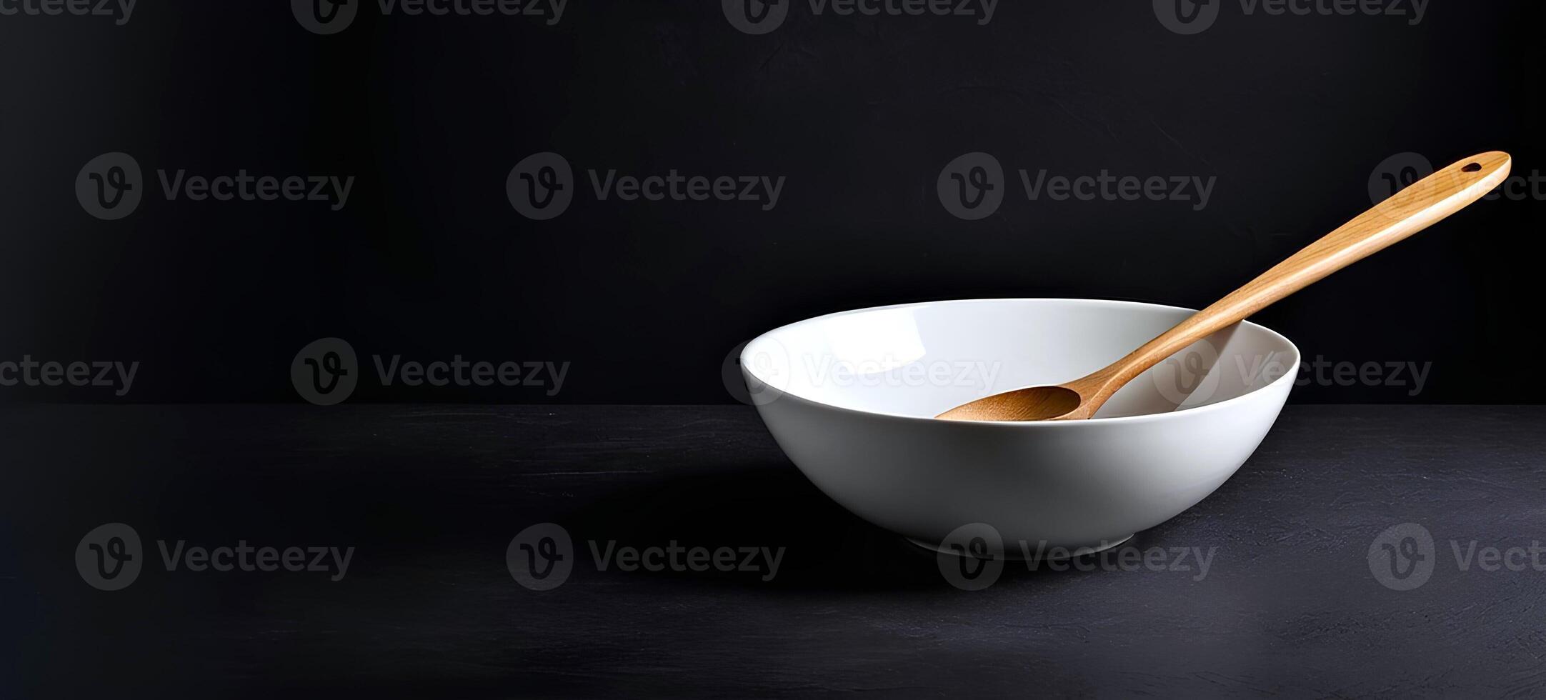 AI generated Empty white bowl with wooden spoon is served on a dark background photo
