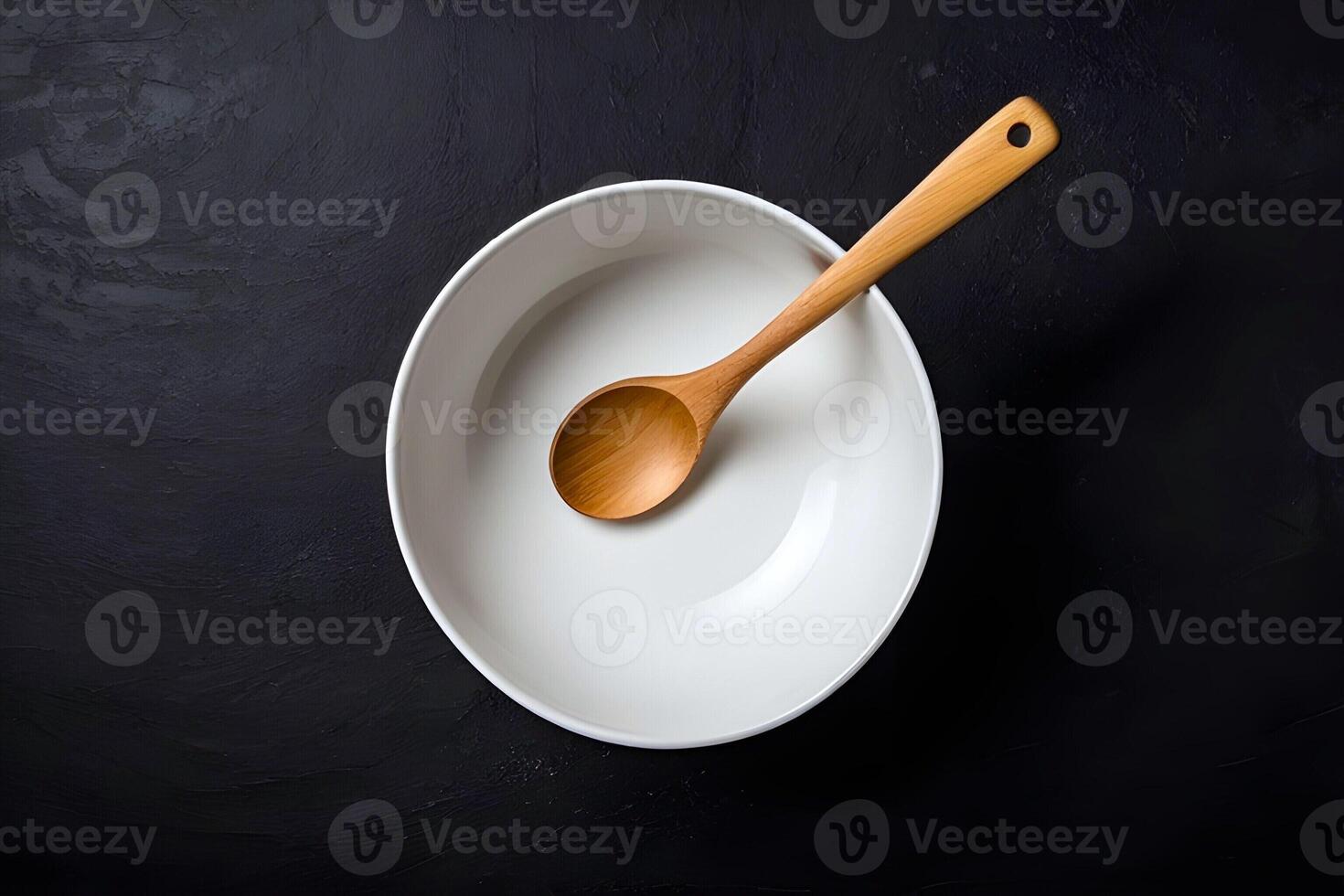 AI generated Top view of an empty white bowl with wooden spoon is served on a dark background photo