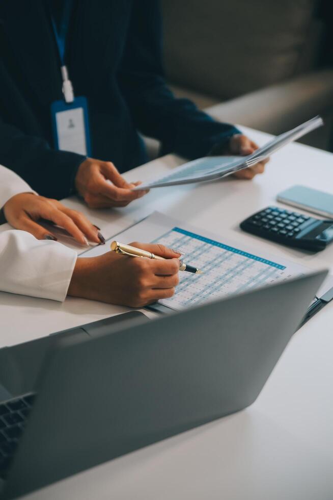Co working conference, Business team meeting present, investor colleagues discussing new plan financial graph data on office table with laptop and digital tablet, Finance, accounting, investment. photo