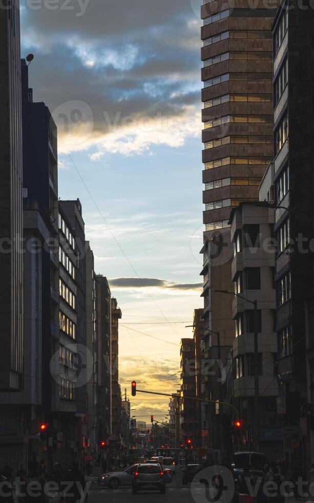 portrait shot of busy traffic and a colorful sunset photo
