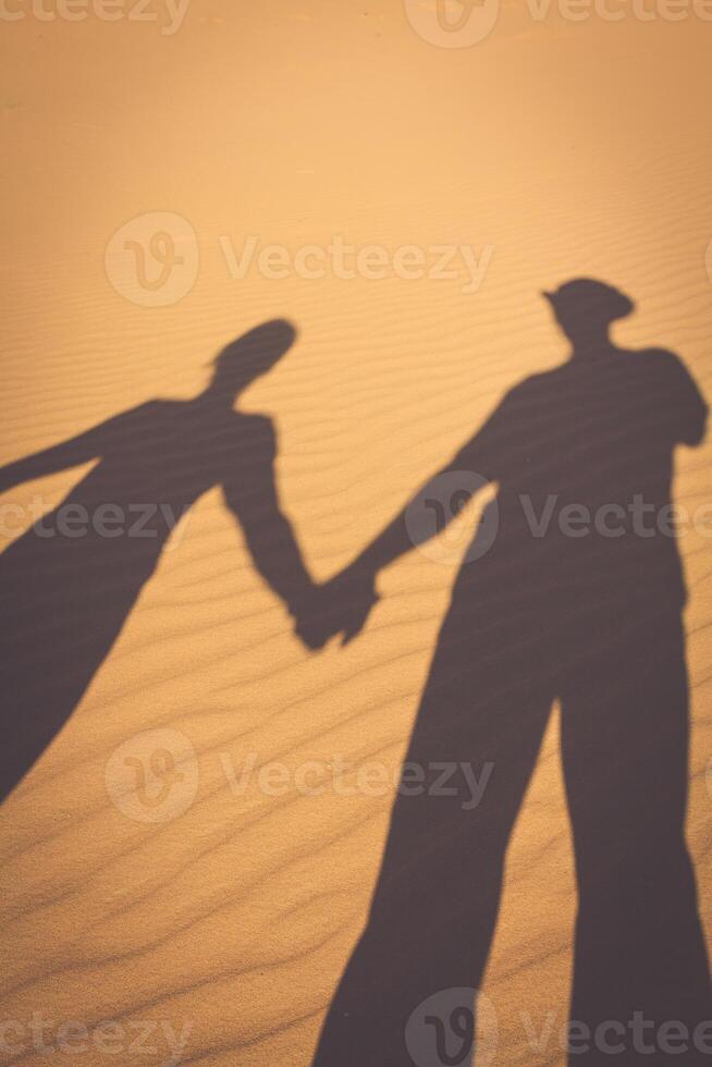 Photographer taking picture of a sand dunes photo