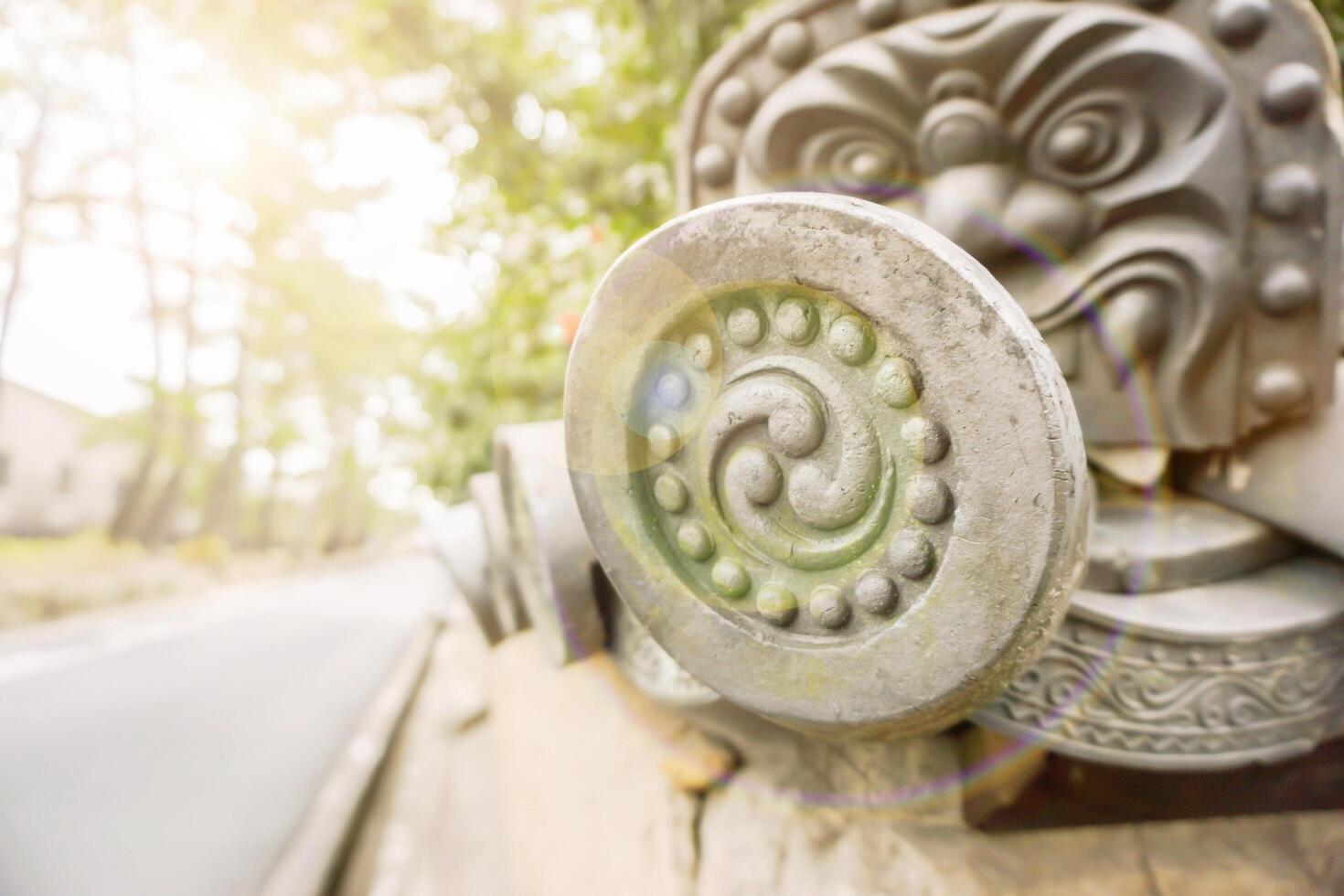 Decorate Japanese ancient of house roof tile in Japan countryside with sun and lens flare background. photo