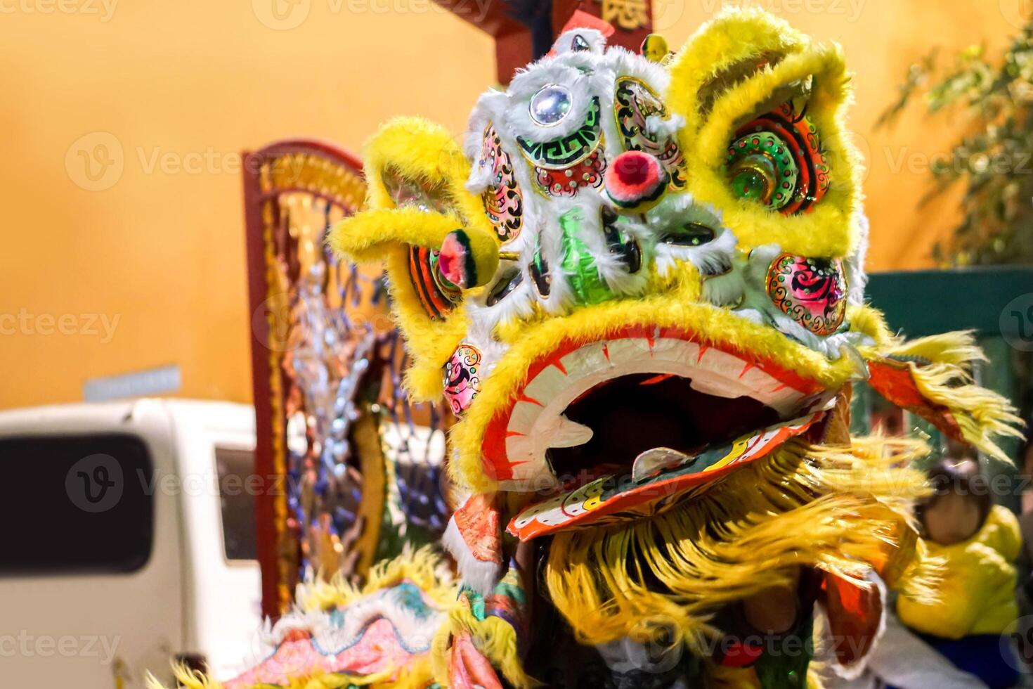 A yellow Chinese lion dancer dress rehearsal performance before the Chinese New Year on 15th Feb 2018. photo
