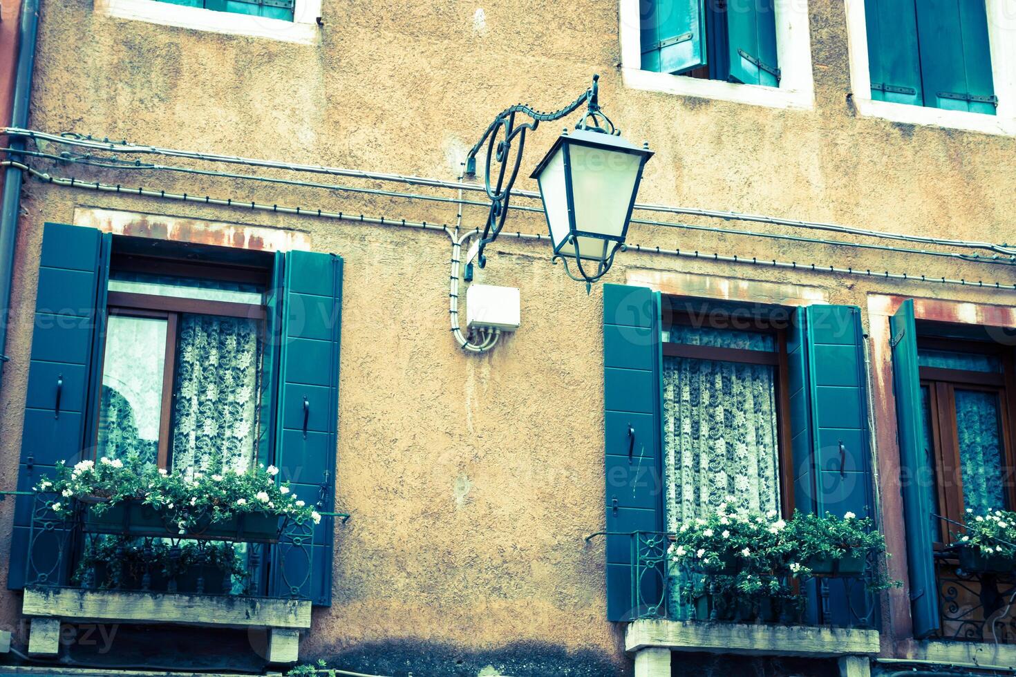 Traditional window of typical old Venice building photo