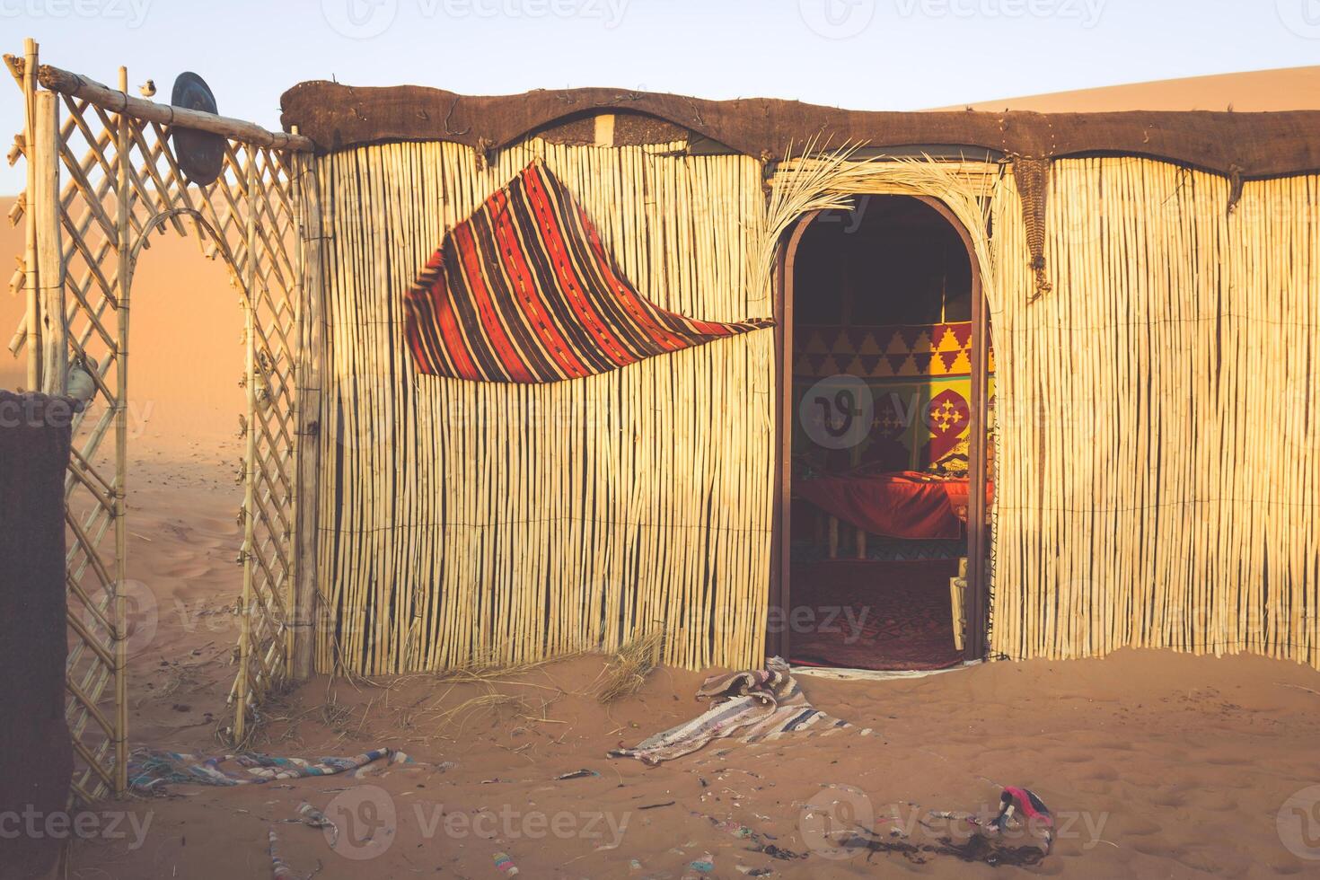 Tent camp for tourists in sand dunes of Erg Chebbi at dawn, Morocco photo