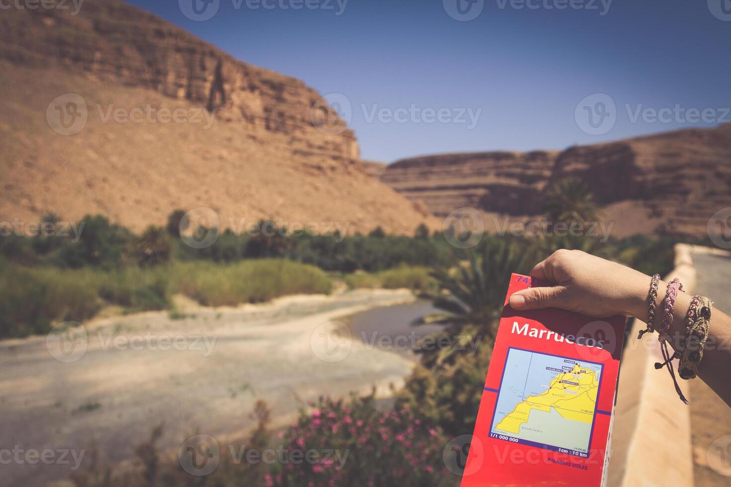 Wide view of canyon and cultivated fields and palms in Errachidia Valley Morocco North Africa Africa photo