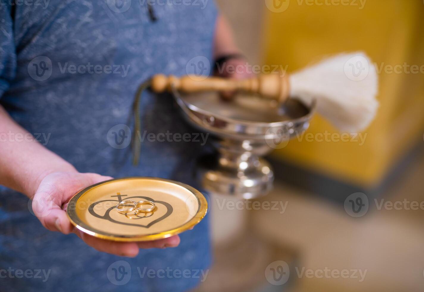 close-up of wedding rings in the church at the wedding ceremony photo