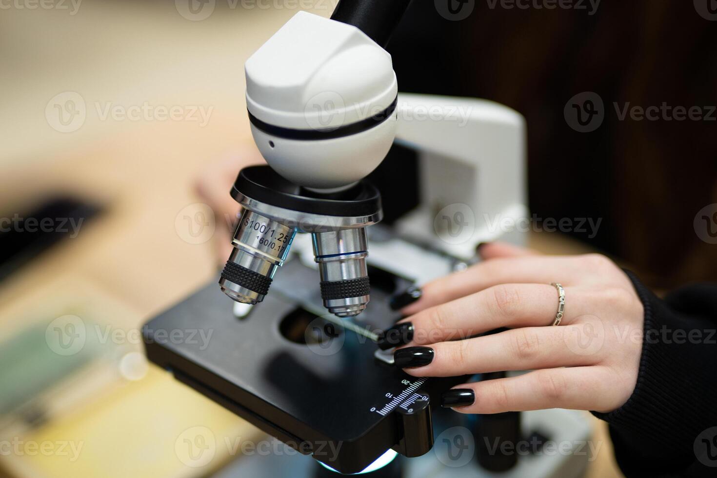 professional microscope in a school laboratory for the study of cells and bacteria photo