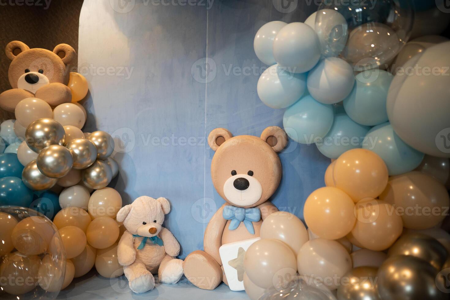 a children's corner of the photo zone with toy bears and balls