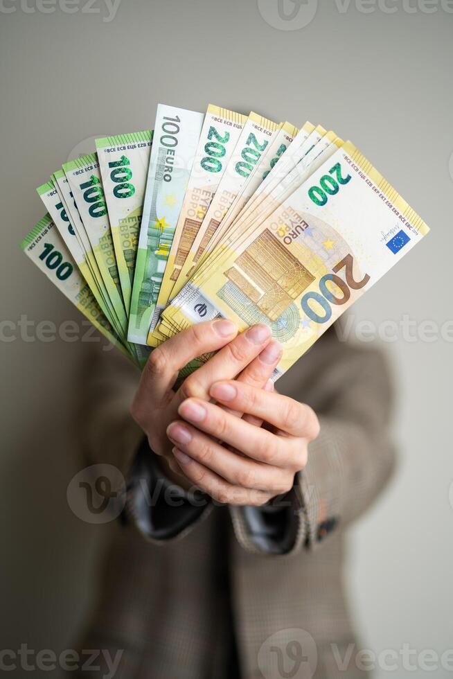 business lady holds euro bills in her hands photo