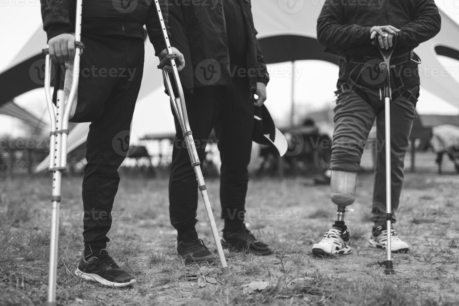 a person with an amputation and a prosthetic leg on crutches photo