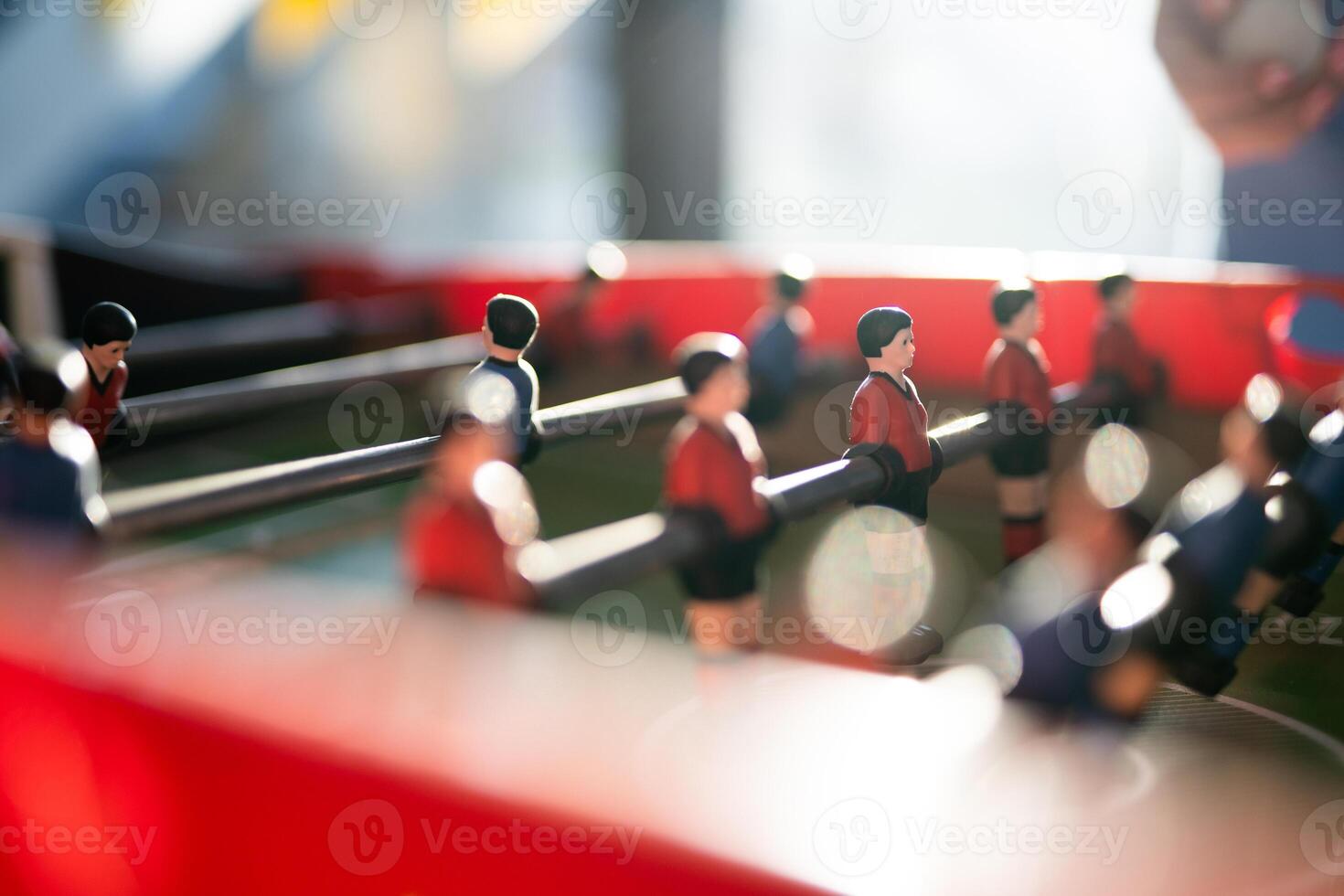 A close-up of the table football game of football figures on the field photo