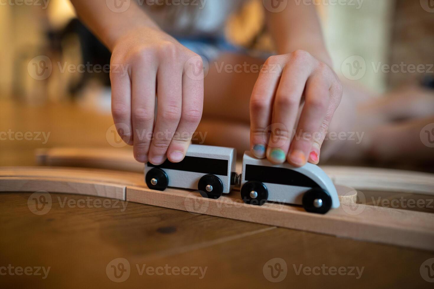 a small child plays with toy cars photo