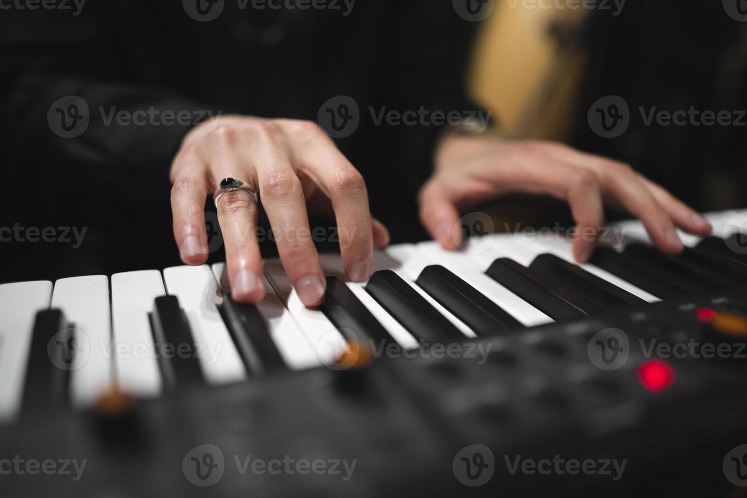 close-up of a pianist's hands while playing the piano photo