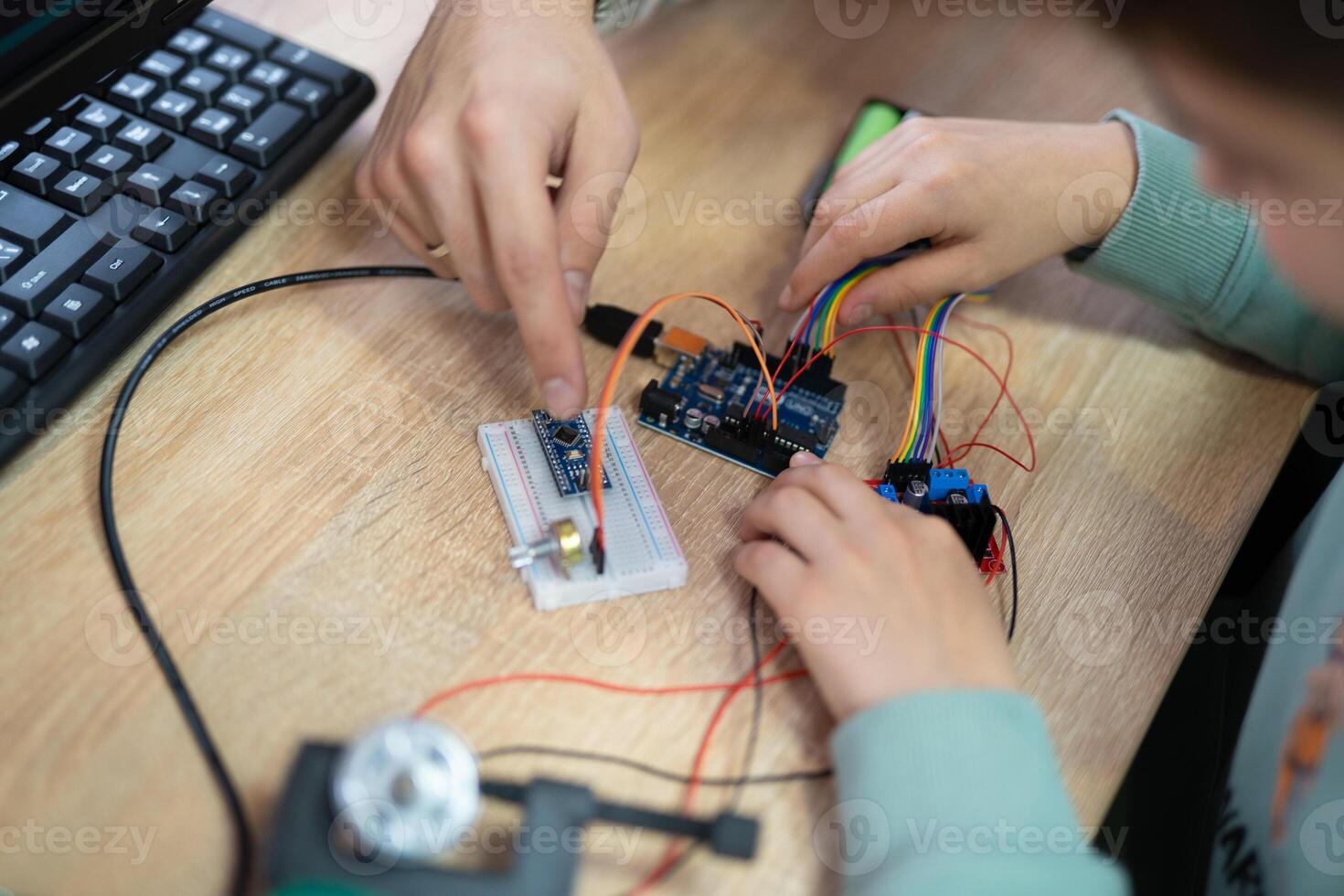 an engineer is engaged in the development and layout of electrical circuits photo