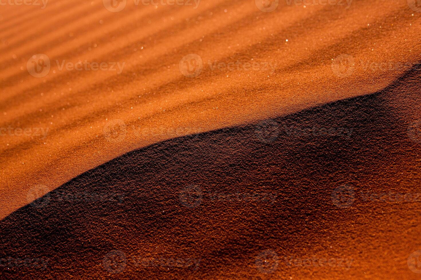 Wadi Rum Desert in Jordan. On the Sunset. Panorama of beautiful sand pattern on the dune. Desert landscape in Jordan. photo