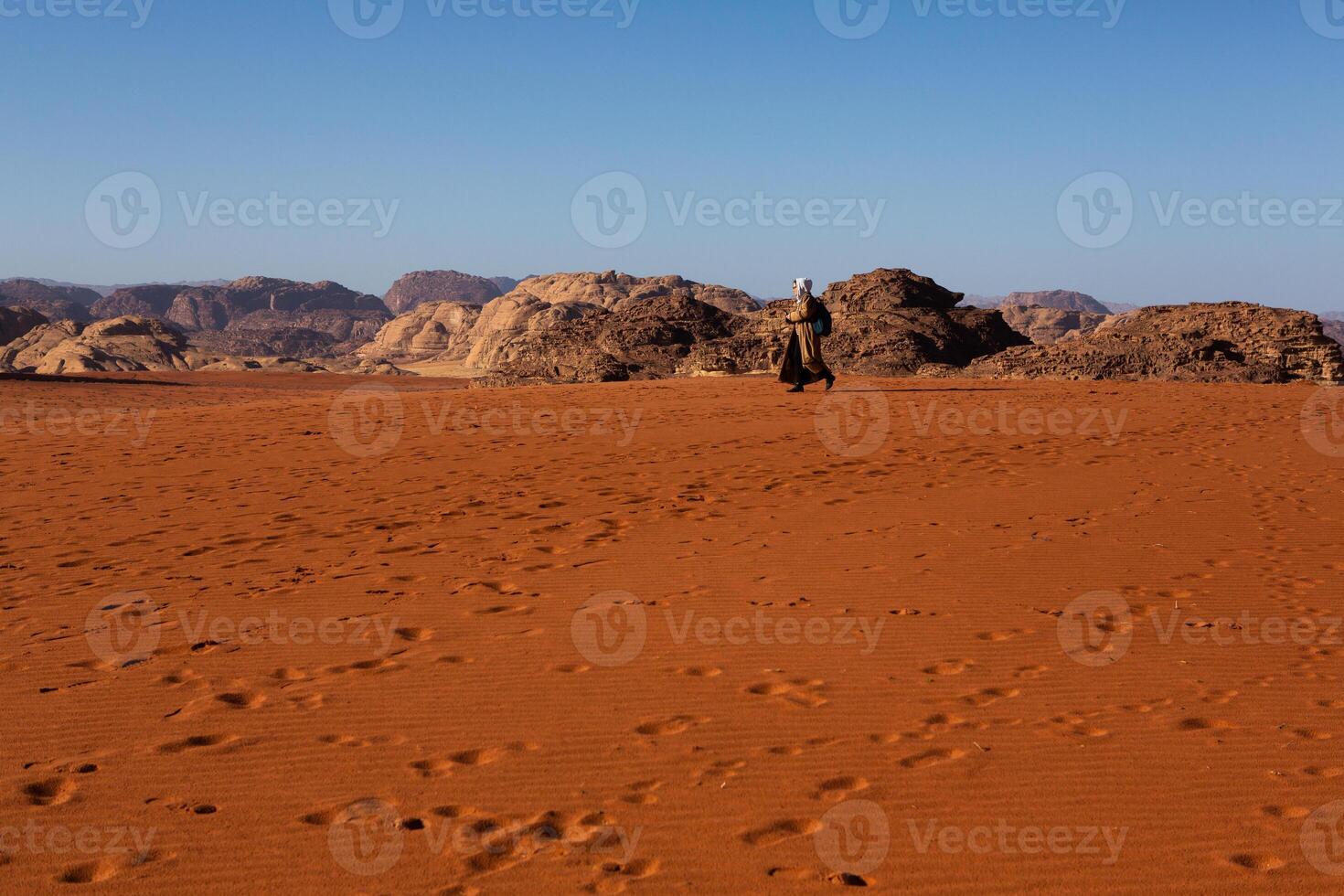 Wadi Rum Desert in Jordan. On the Sunset. Panorama of beautiful sand pattern on the dune. Desert landscape in Jordan. photo