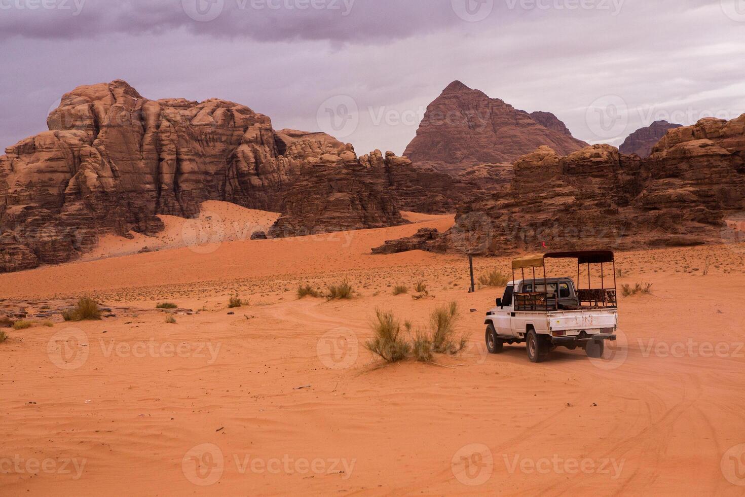 Wadi Rum Desert in Jordan. On the Sunset. Panorama of beautiful sand pattern on the dune. Desert landscape in Jordan. photo
