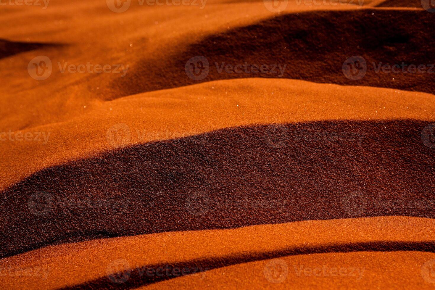 Wadi Rum Desert in Jordan. On the Sunset. Panorama of beautiful sand pattern on the dune. Desert landscape in Jordan. photo