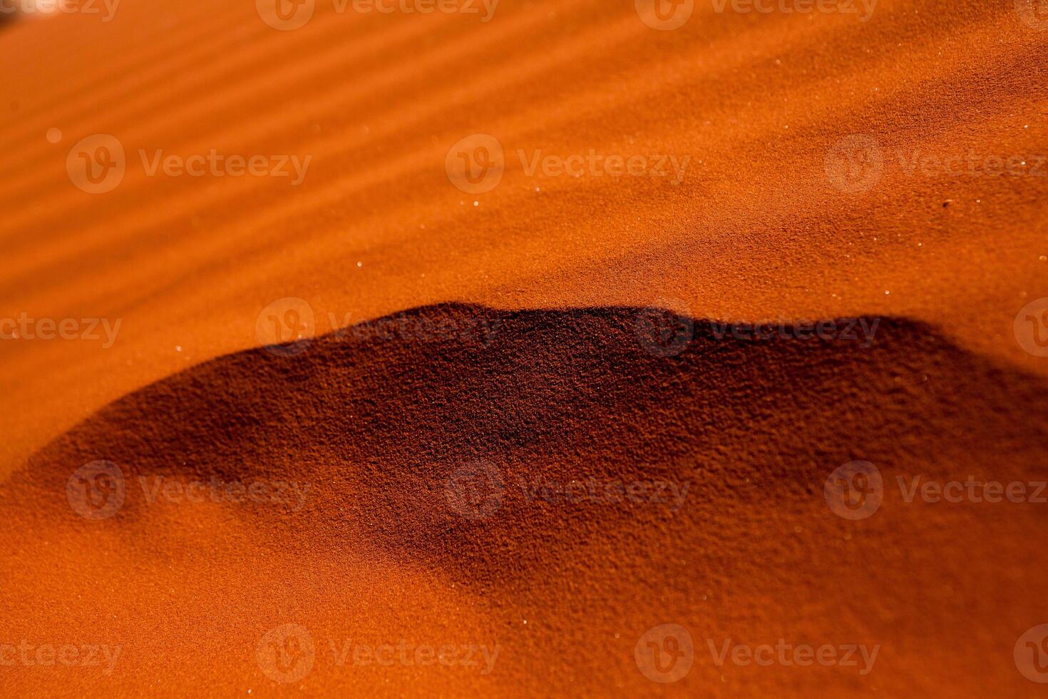 Wadi Rum Desert in Jordan. On the Sunset. Panorama of beautiful sand pattern on the dune. Desert landscape in Jordan. photo
