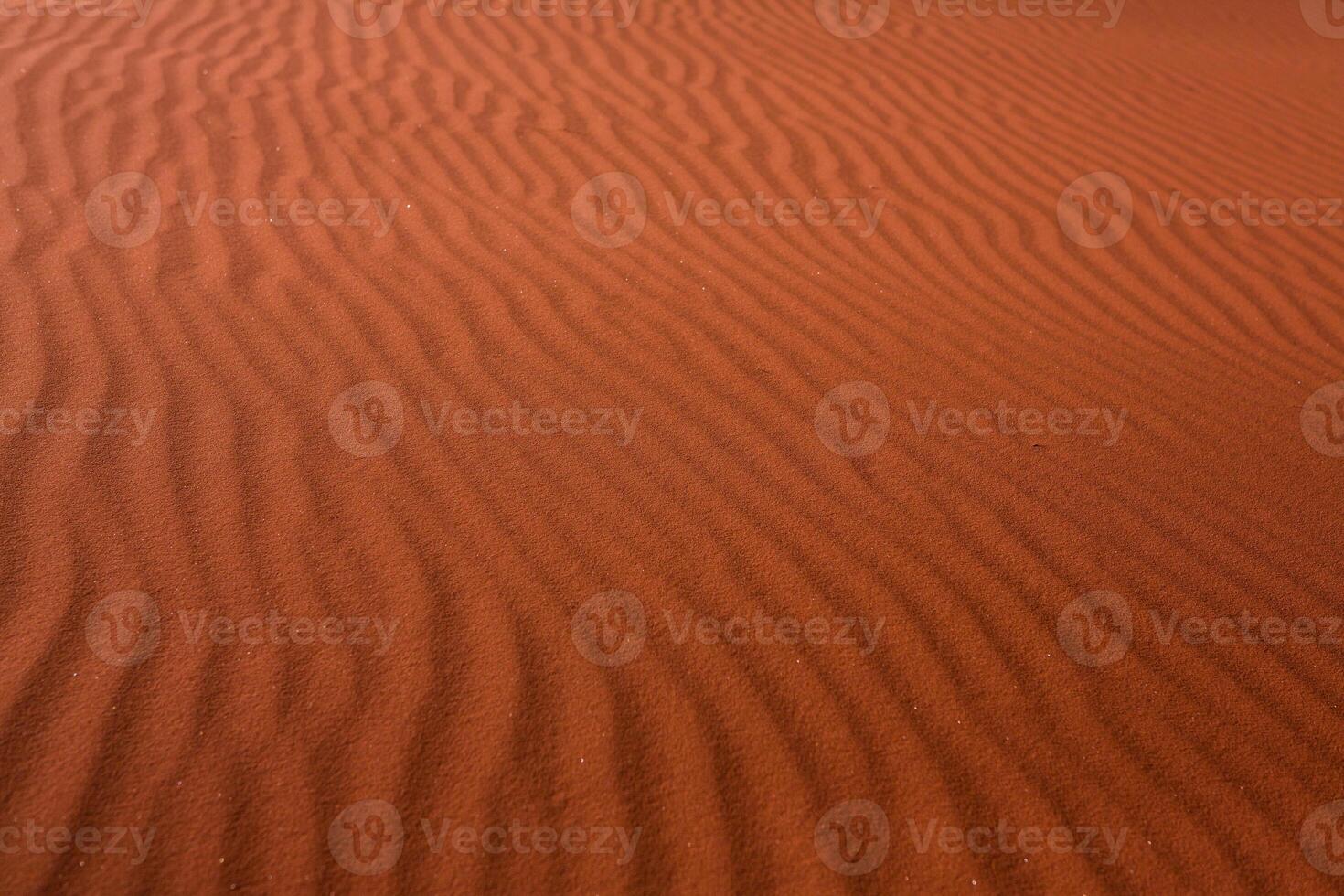 Wadi Rum Desert in Jordan. On the Sunset. Panorama of beautiful sand pattern on the dune. Desert landscape in Jordan. photo