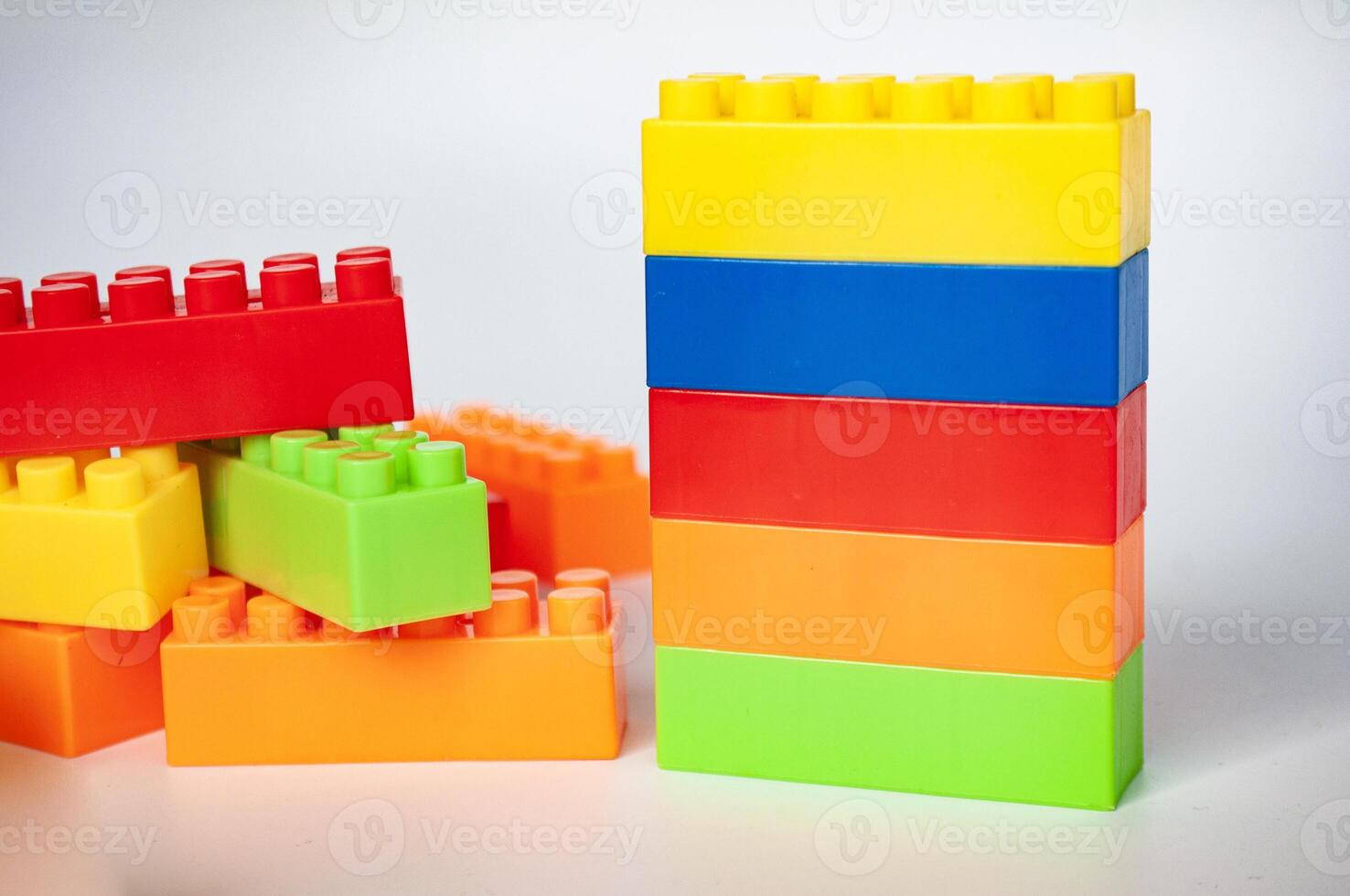 Plastic building blocks on white background. photo