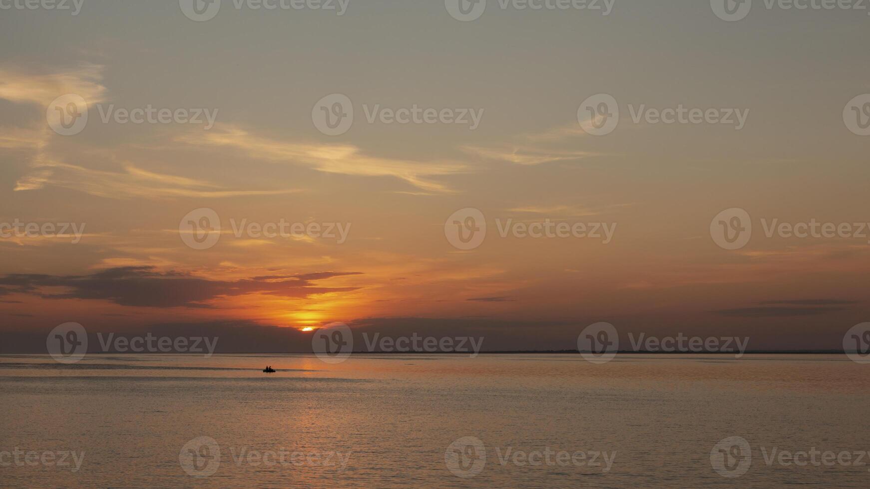 silhouette of rubber boat and golden sunset,Surin Island National park, Thailand photo