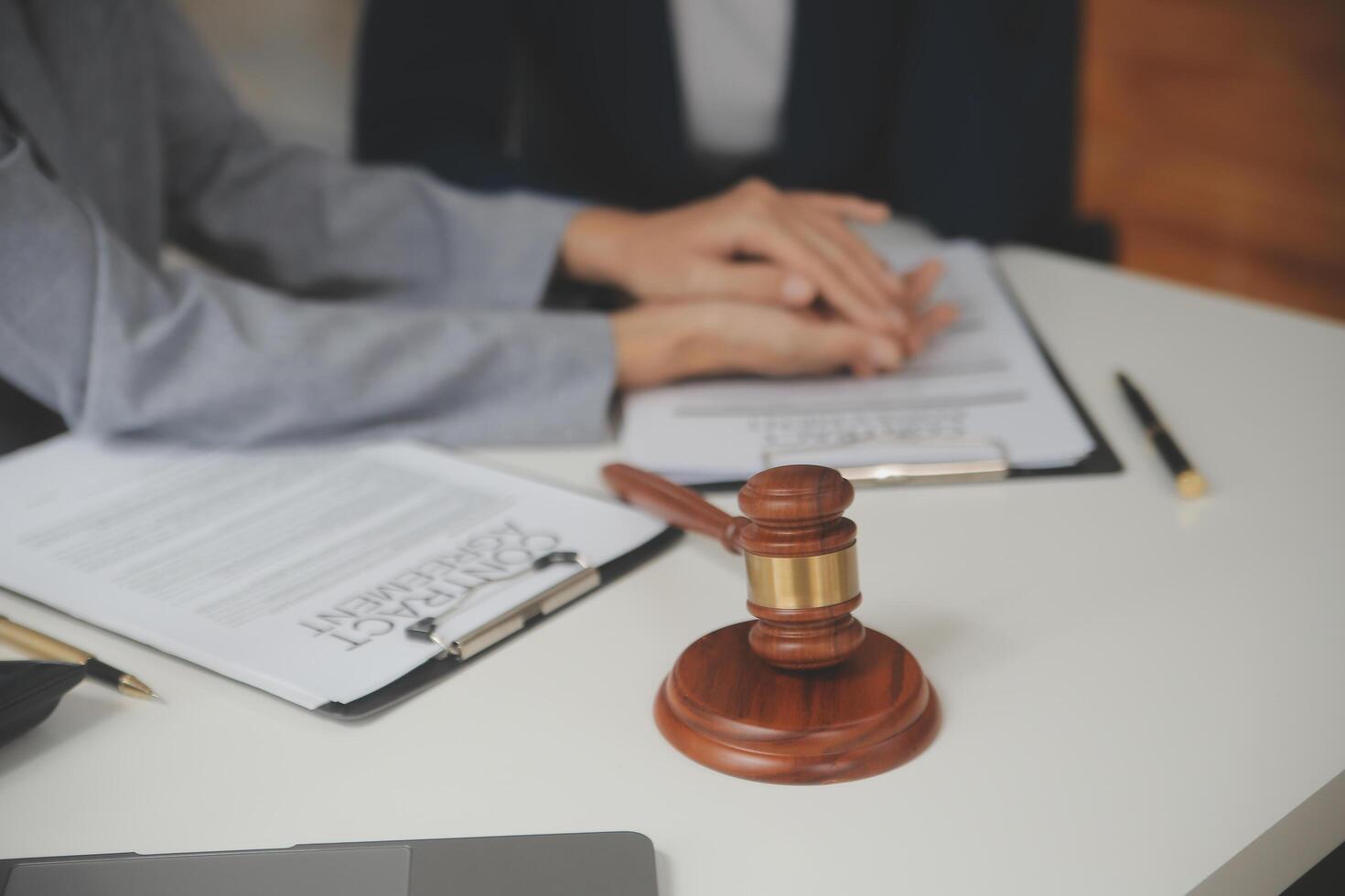 Lawyer, legal advisor, businessman brainstorming information on agreement details Business contracts in legal processing books for accuracy in contract documents. joint financial investment. photo