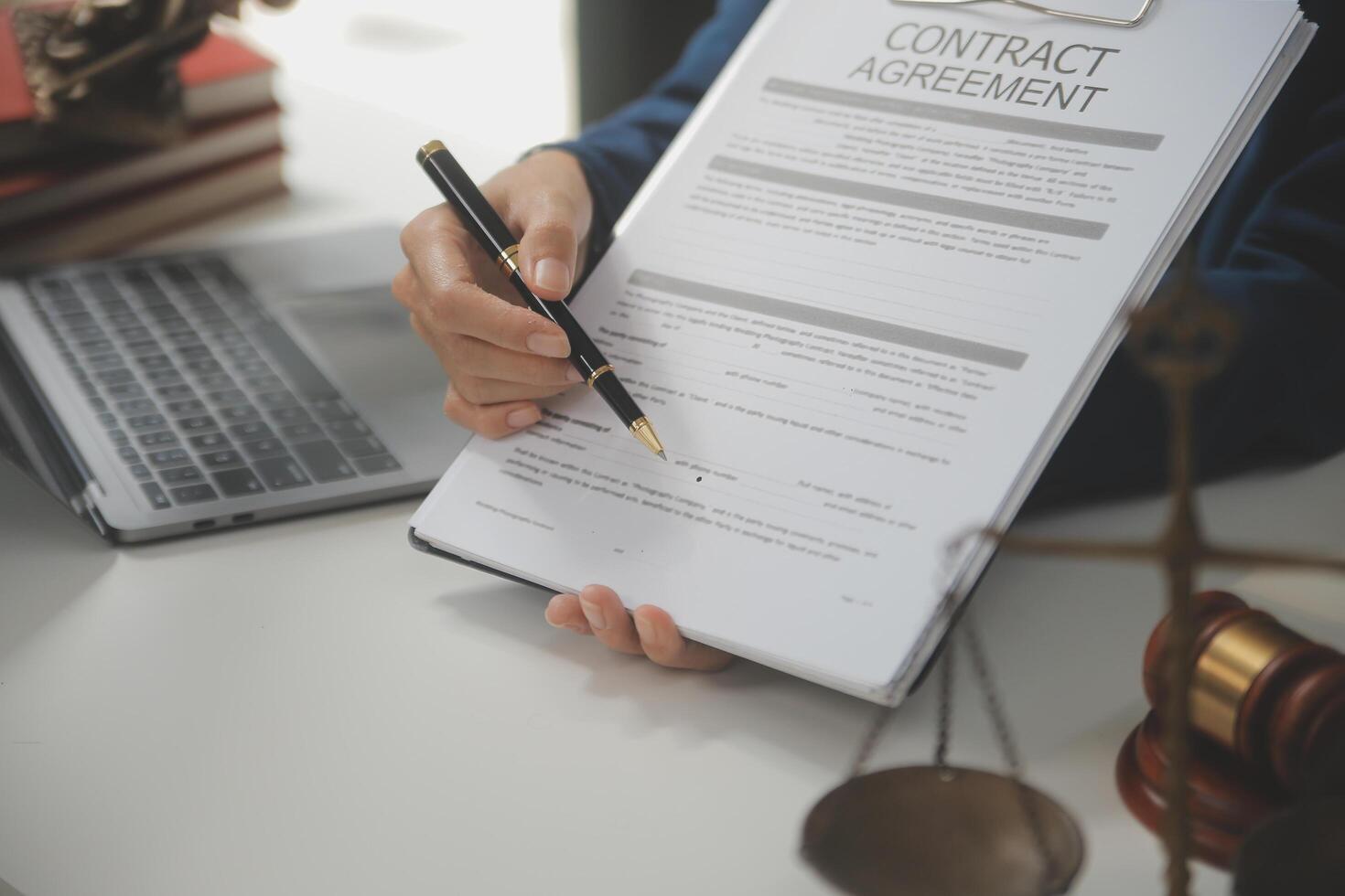 Lawyer, legal advisor, businessman brainstorming information on agreement details Business contracts in legal processing books for accuracy in contract documents. joint financial investment. photo
