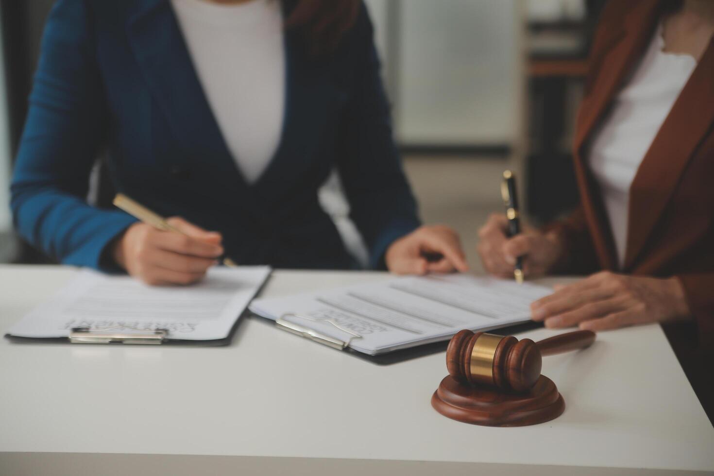 Lawyer, legal advisor, businessman brainstorming information on agreement details Business contracts in legal processing books for accuracy in contract documents. joint financial investment. photo