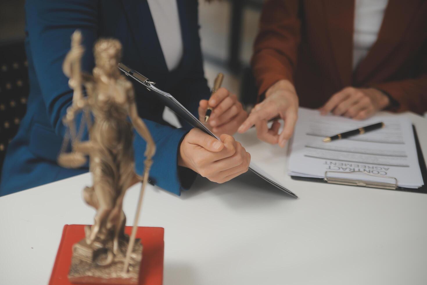 Lawyer, legal advisor, businessman brainstorming information on agreement details Business contracts in legal processing books for accuracy in contract documents. joint financial investment. photo