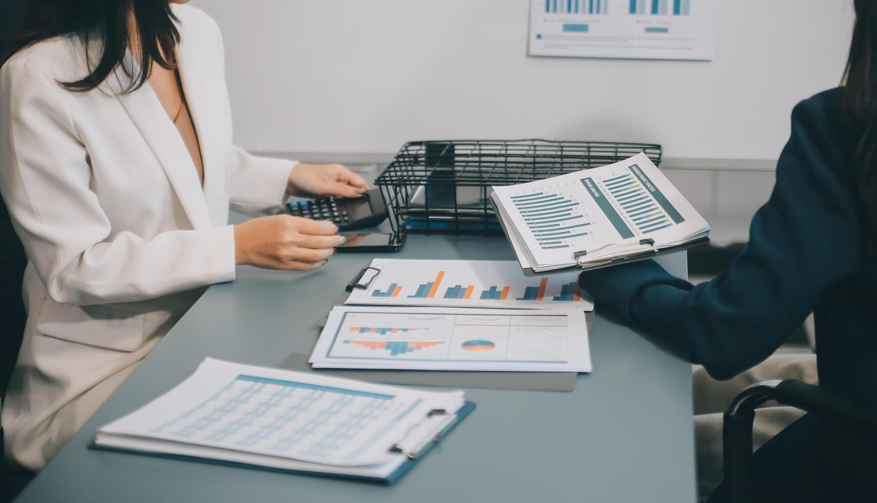 Co working conference, Business team meeting present, investor colleagues discussing new plan financial graph data on office table with laptop and digital tablet, Finance, accounting, investment. photo