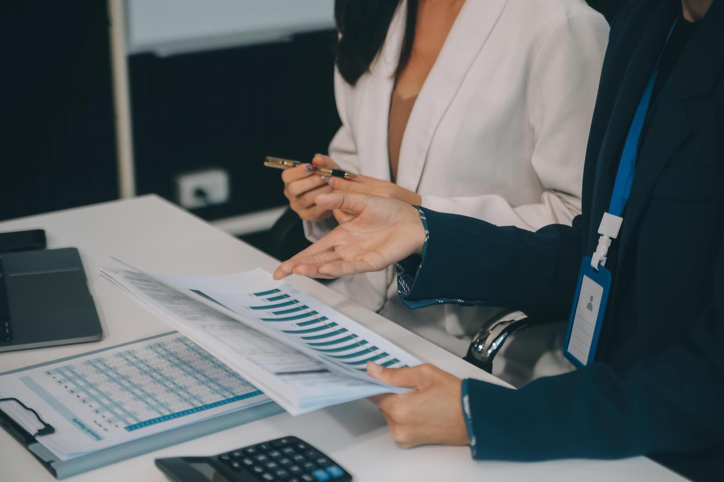 Co working conference, Business team meeting present, investor colleagues discussing new plan financial graph data on office table with laptop and digital tablet, Finance, accounting, investment. photo