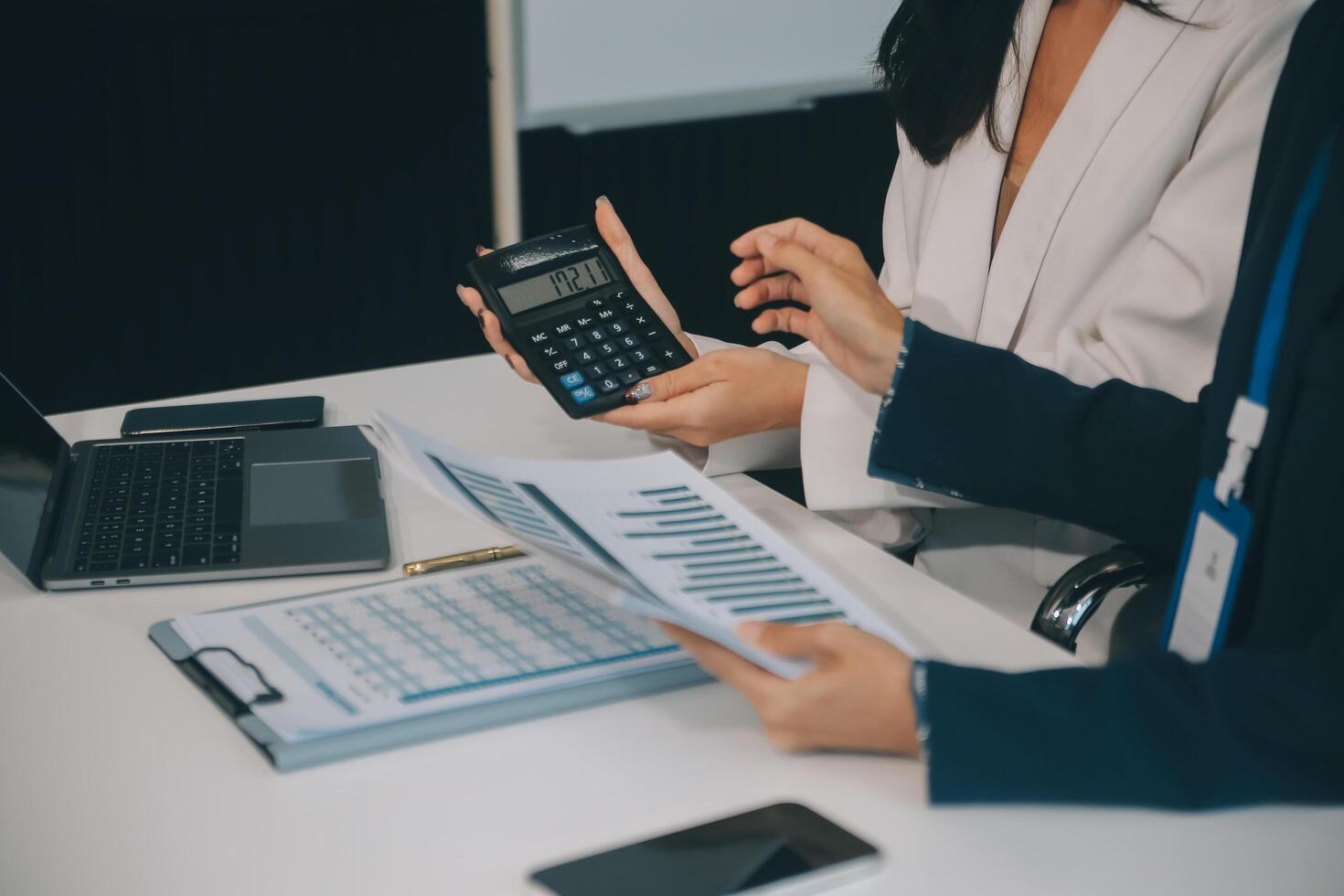 Co working conference, Business team meeting present, investor colleagues discussing new plan financial graph data on office table with laptop and digital tablet, Finance, accounting, investment. photo
