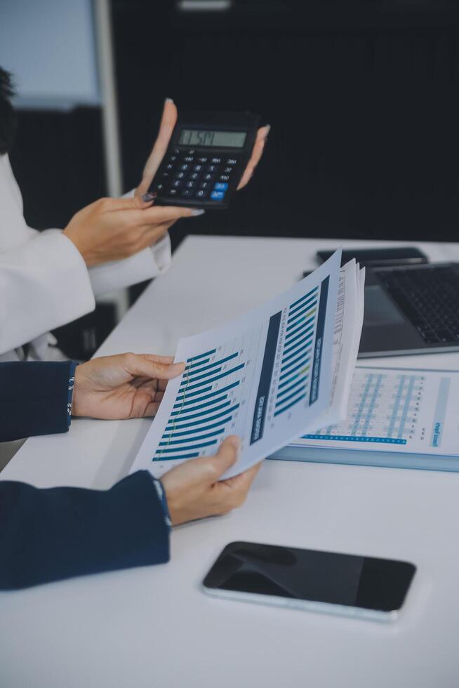 Co working conference, Business team meeting present, investor colleagues discussing new plan financial graph data on office table with laptop and digital tablet, Finance, accounting, investment. photo