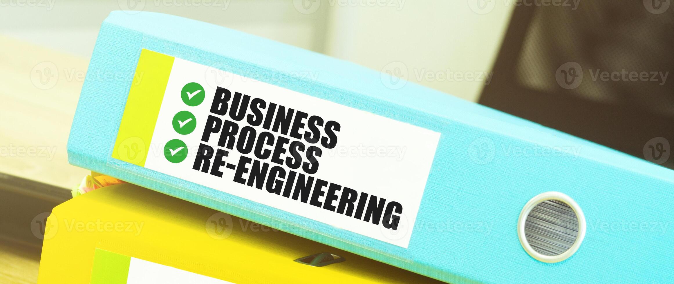 Two office folders with text BUSINESS PROCESS RE ENGINEEERING photo