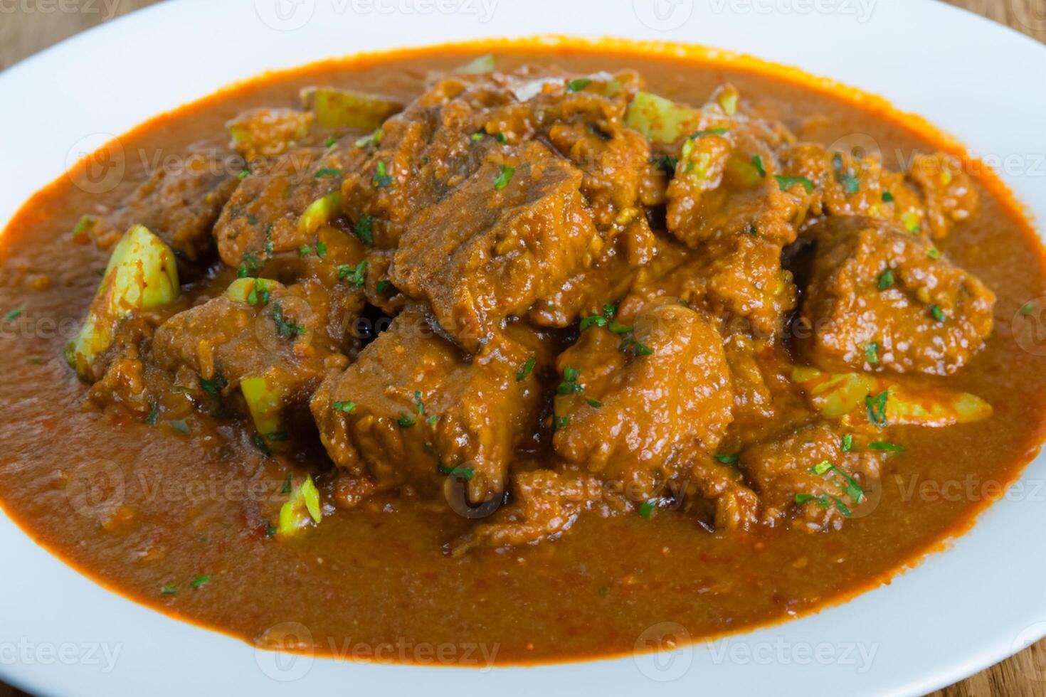 Savor the Exquisite Lamb or Beef Curry Rendang, Ready to Be Relished on Eid al-Adha, Capturing the Essence of Celebration in a Perfect Photo, Showcasing Culinary Mastery and Festive Indulgence photo